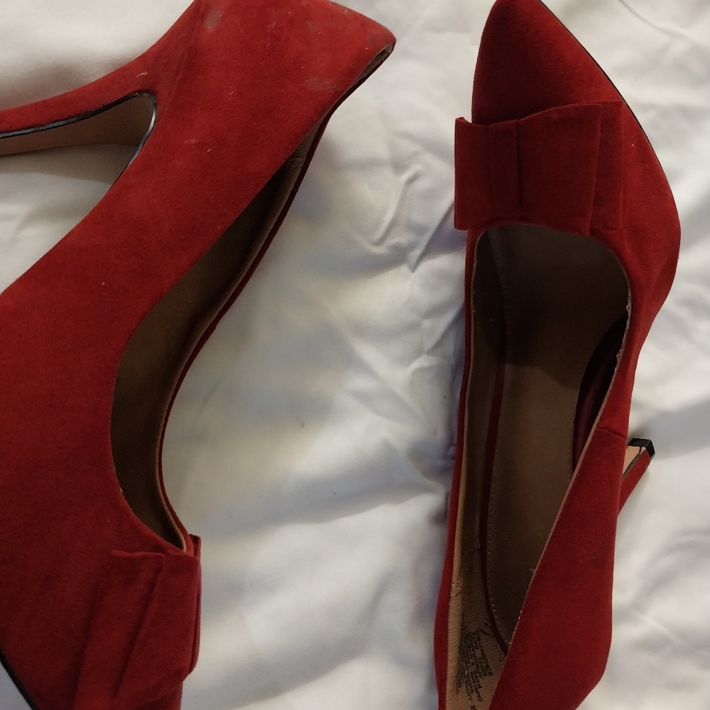Red faux suede pumps